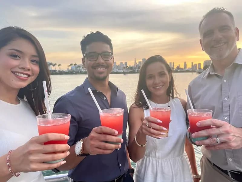 Guests enjoying cocktails aboard a Miami sunset cruise