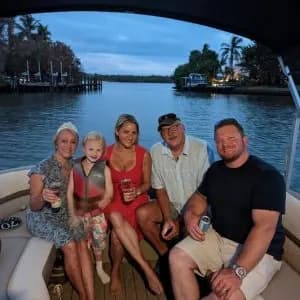 Family enjoying a private cruise at dusk